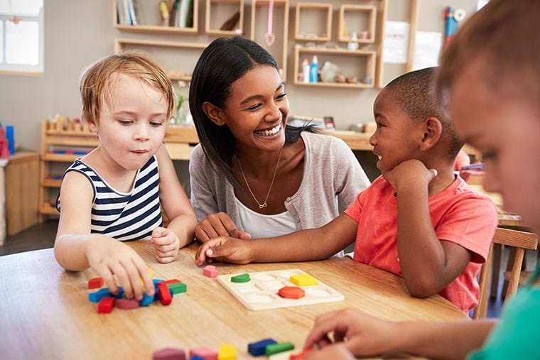 Teacher With Students And Shapes Card