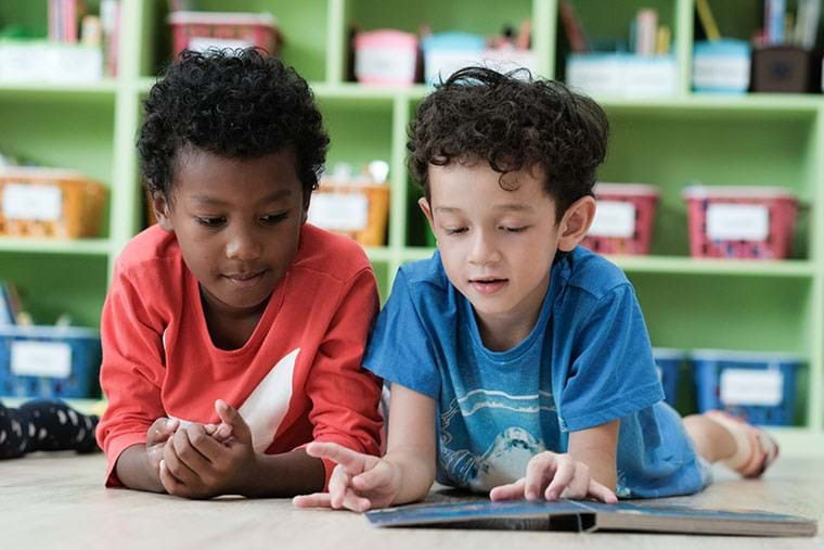 Two students read together