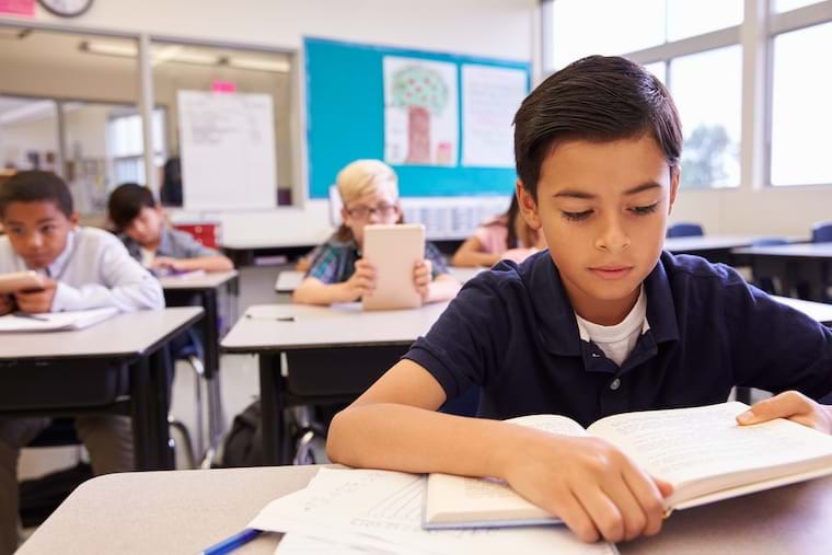 Child reading in class